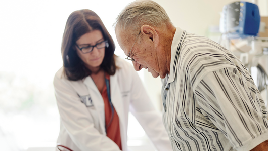 Doctor helping patient