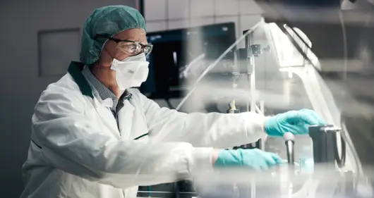 Scientist in protective clothing