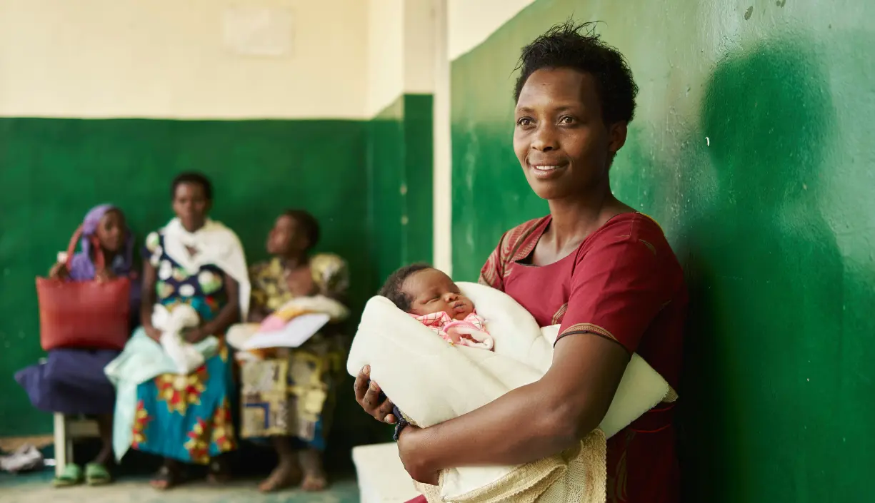 Mother waiting with an infant in a clinic