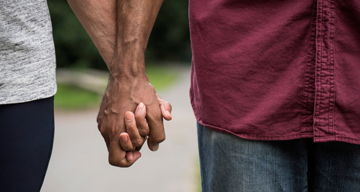 A couple holding hands