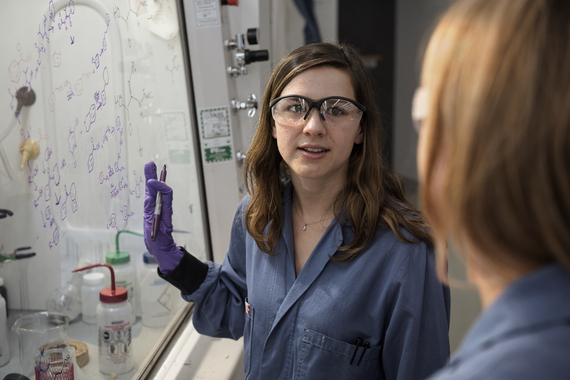 Scientist discussing research in laboratory