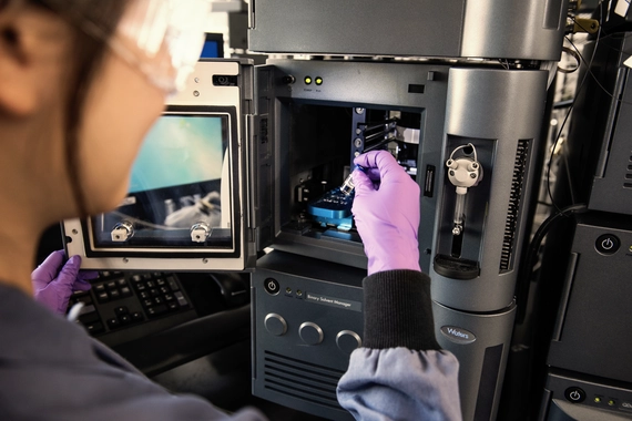 Scientist preparing sample in laboratory microcopy Workspace