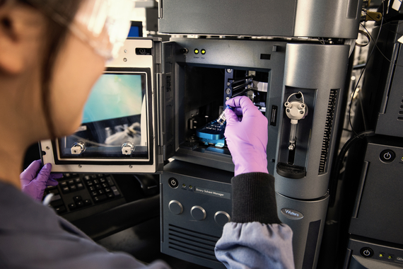 Scientist preparing sample in laboratory microcopy Workspace