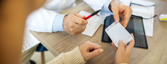 pharmacist looking over prescription