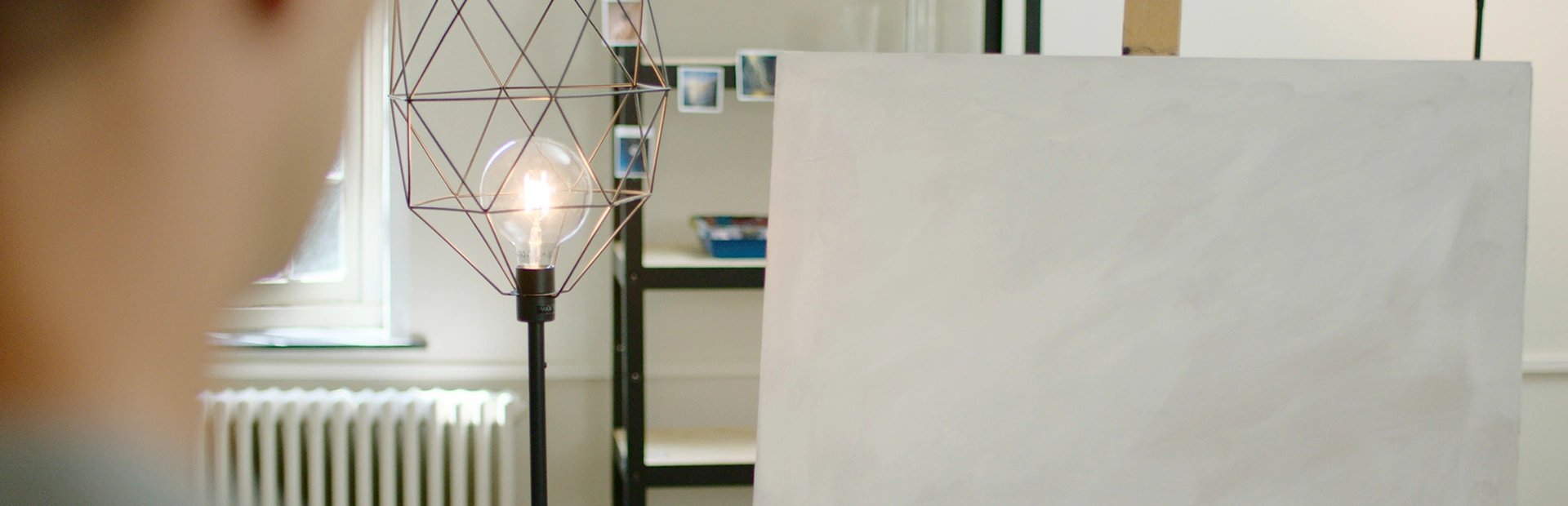 Man looks at empty painting