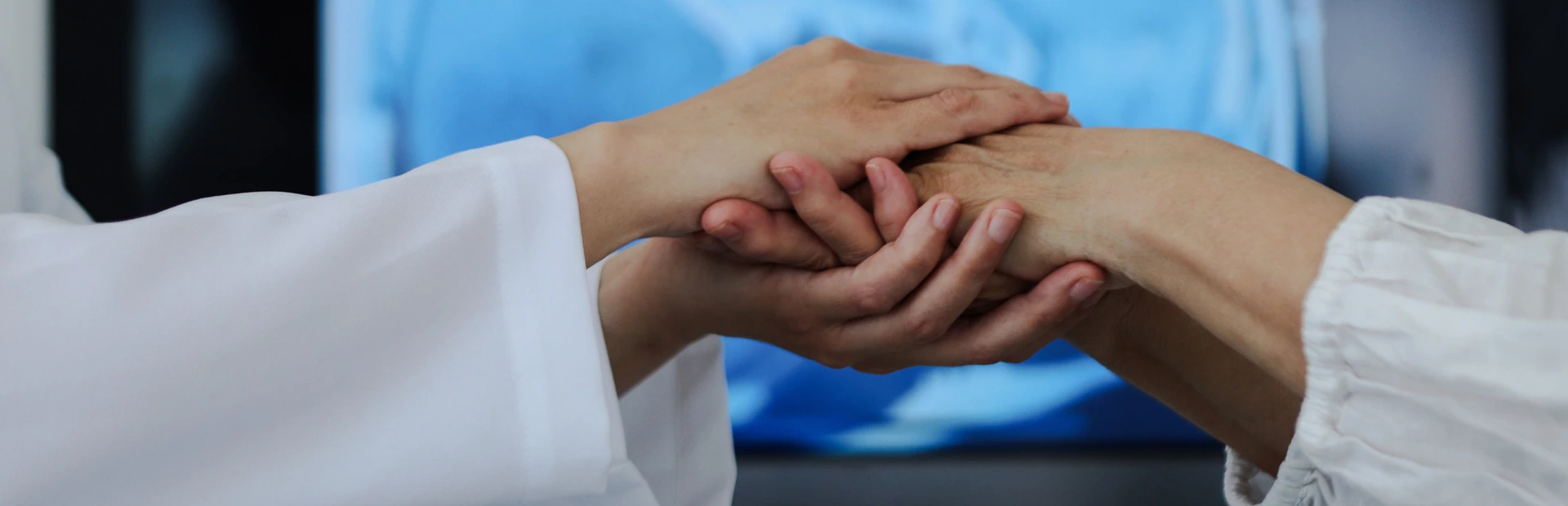 Doctor holding patients hand
