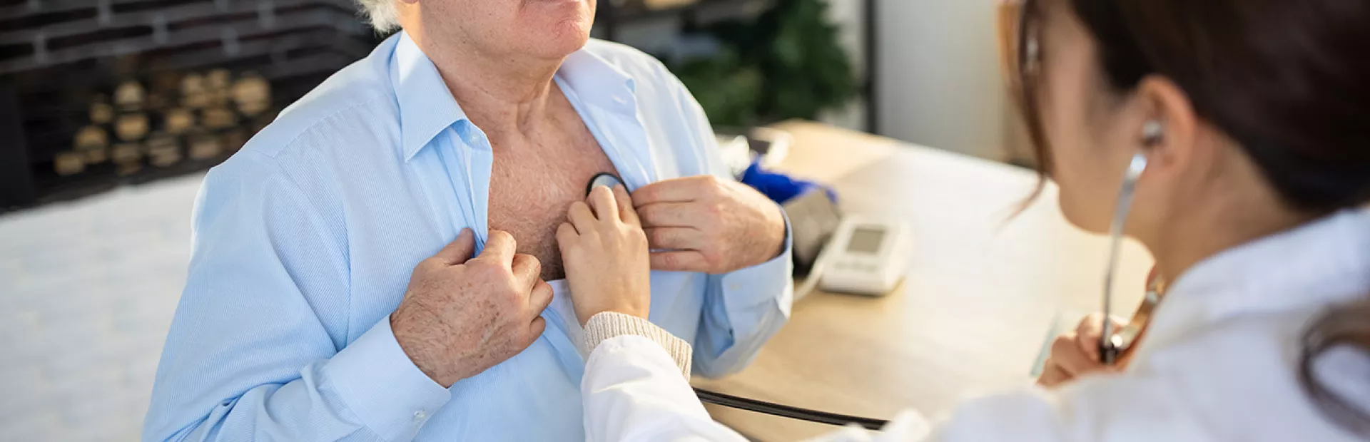 A person getting a heart check from a doctor