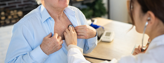 A person getting a heart check from a doctor