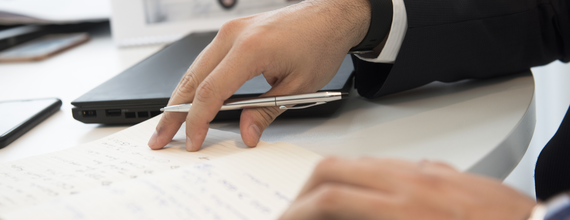 Worker taking notes