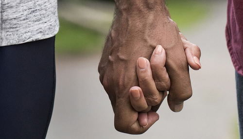 A couple holding hands