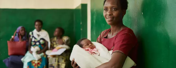 Mother waiting with an infant in a clinic