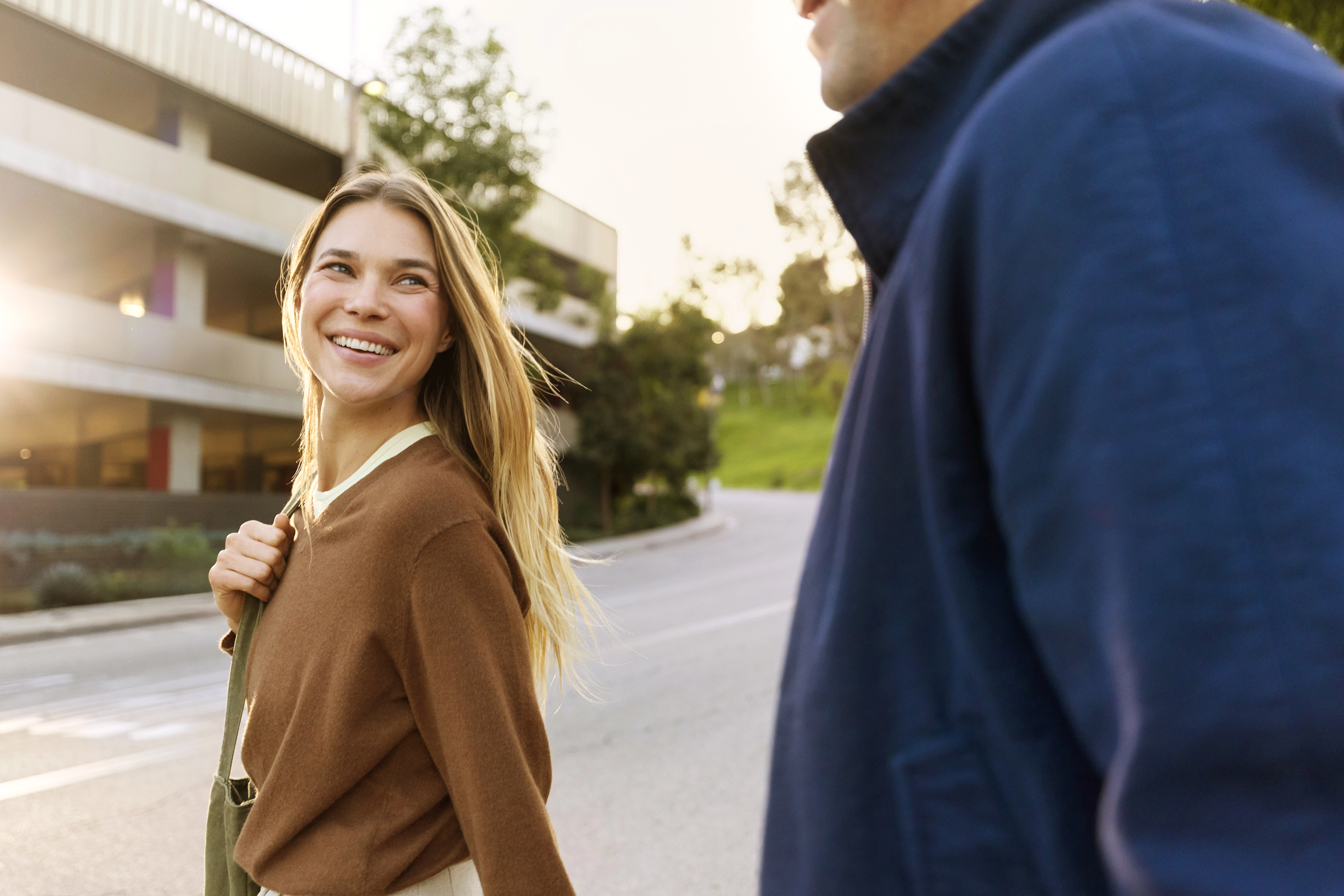 People walking outdoors during sunset