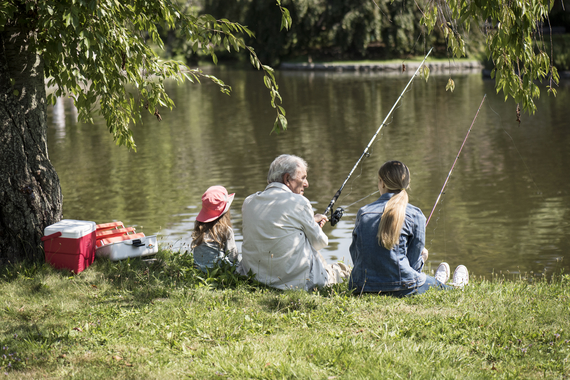 Man and children fishing
