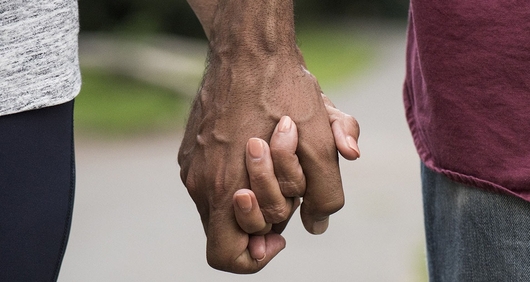 A couple holding hands