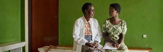HCP sitting with a patient