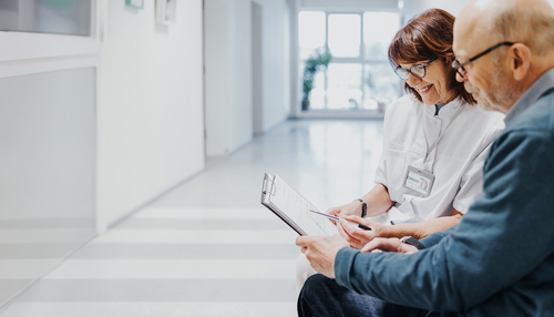 Healthcare professional talking with patient.