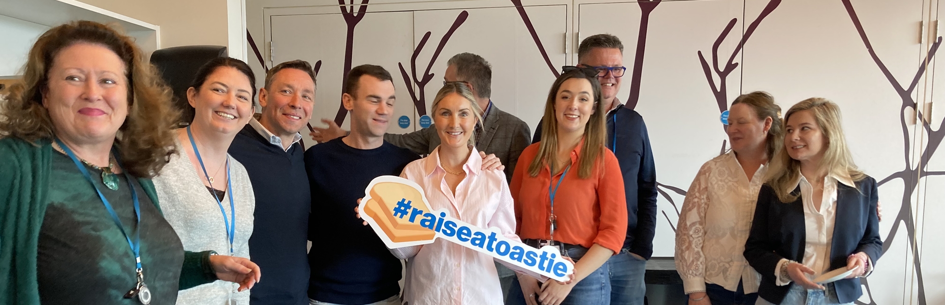 Image of Novartis staff raising a toastie to support rare disease day
