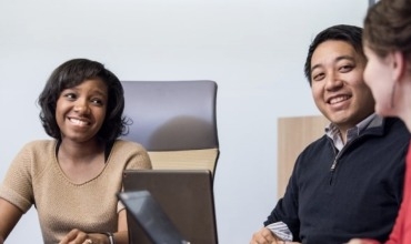 A group of people in a business meeting