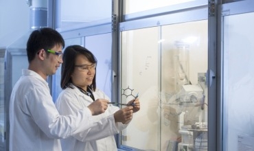 Woman and man in Novartis lab 