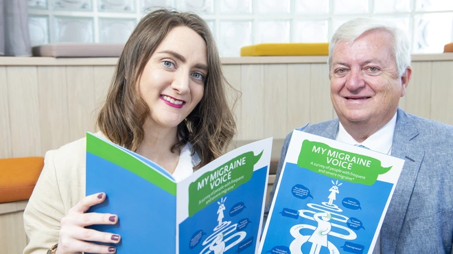 Louise O'Sullivan and Patrick Little holding the My Migraine Voice Report