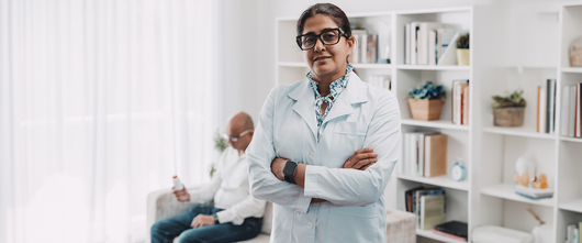 Doctor with patient in the background