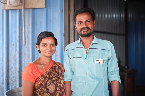A woman and a man standing in a rural setting