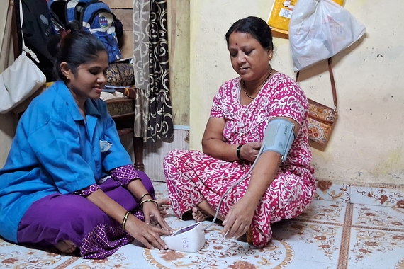 Woman checking her blood pressure