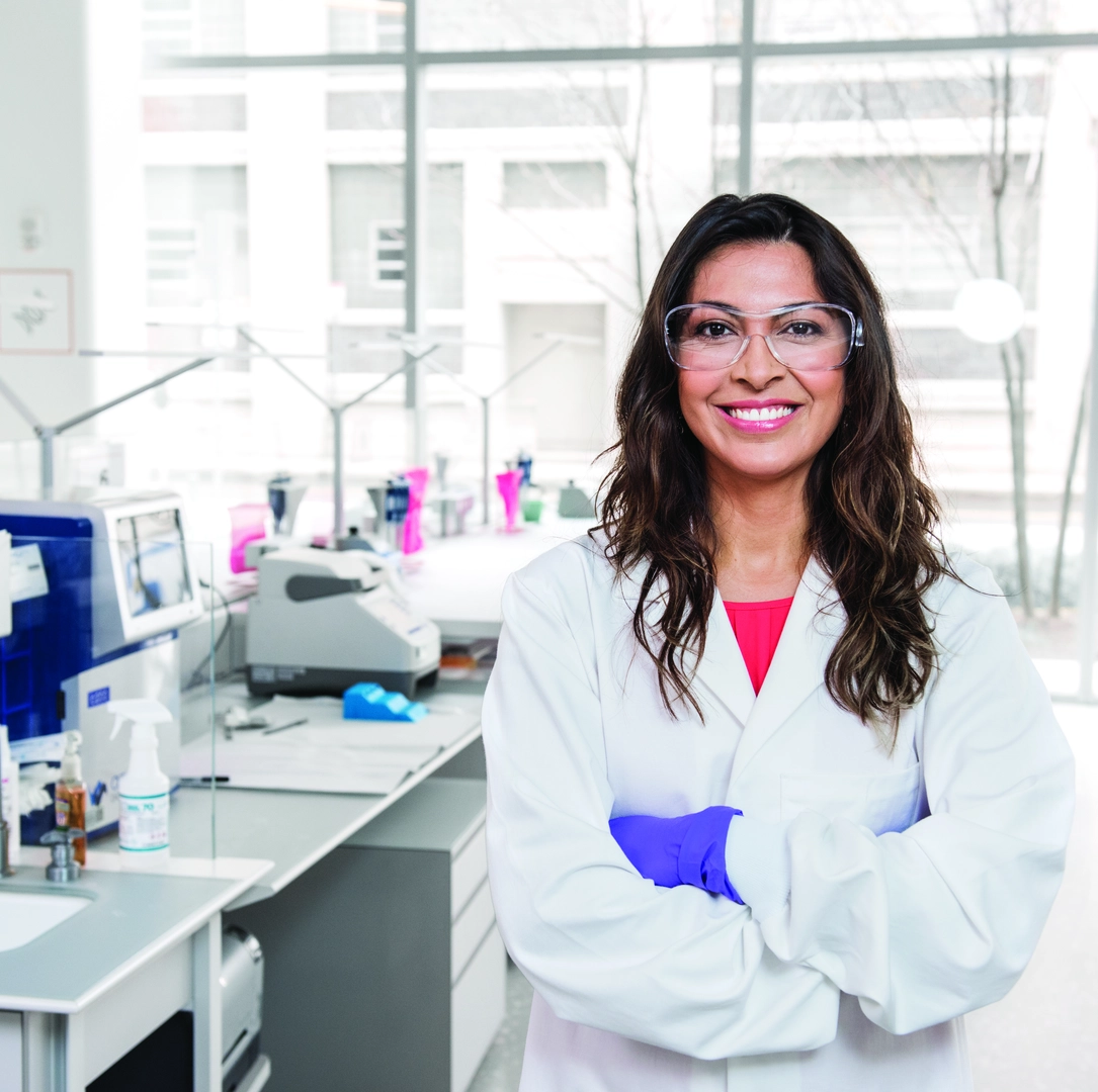 A happy scientist with goggles in the lab