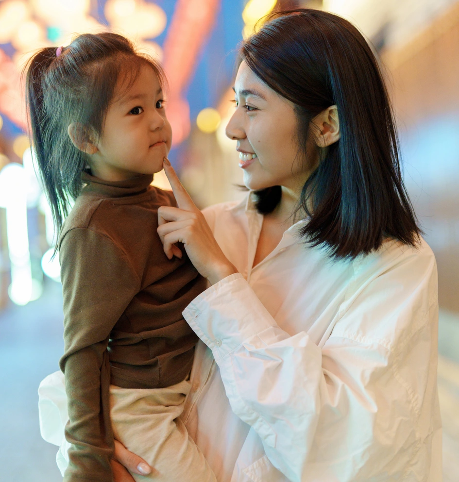 Parent and child enjoying a night out