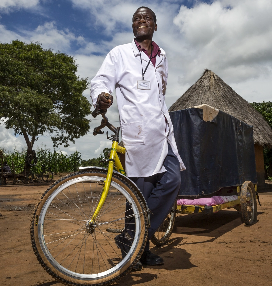Tricycle with a house-shaped cart in a rural setting