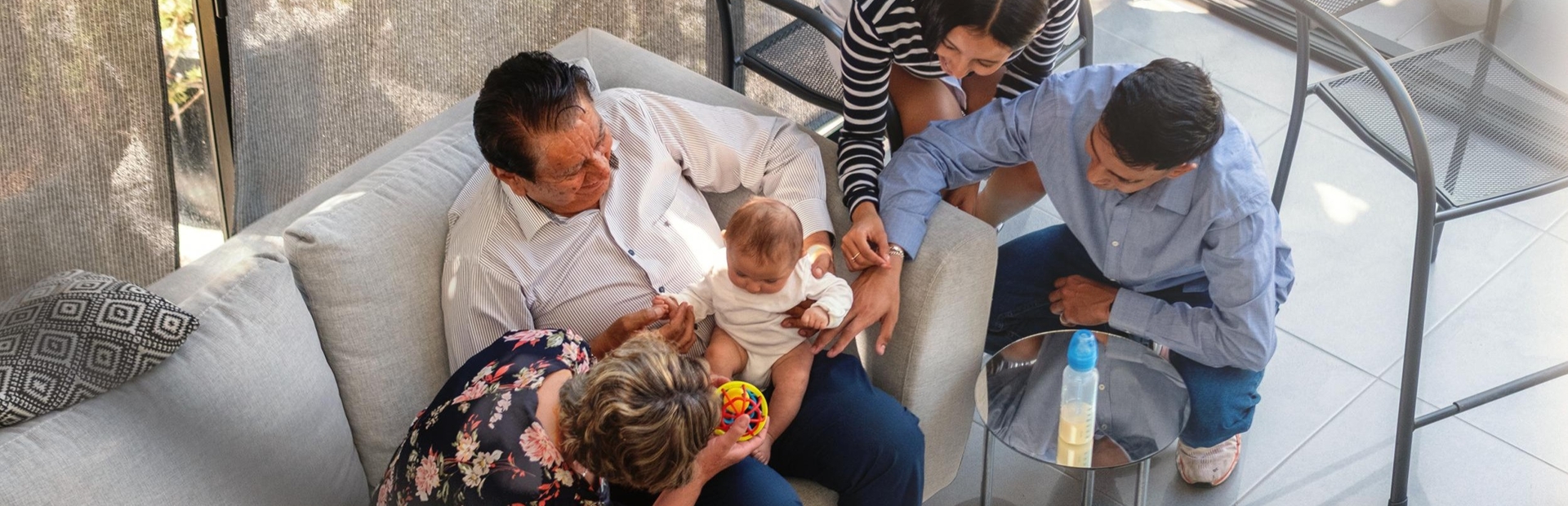 family-gathering-with-a-baby-in-a-cozy-living-room