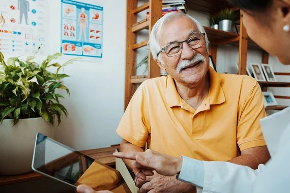 hcp-discussing-with-smilling-senior-patient-card