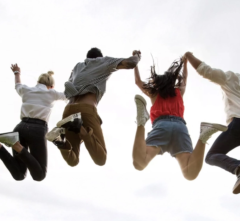 Young adults jumping
