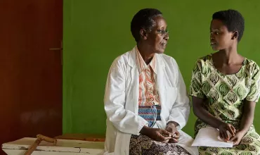 hcp patient discussing sitting bench rwanda