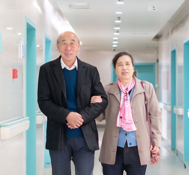 An old couple in the corridor of a hospital in China