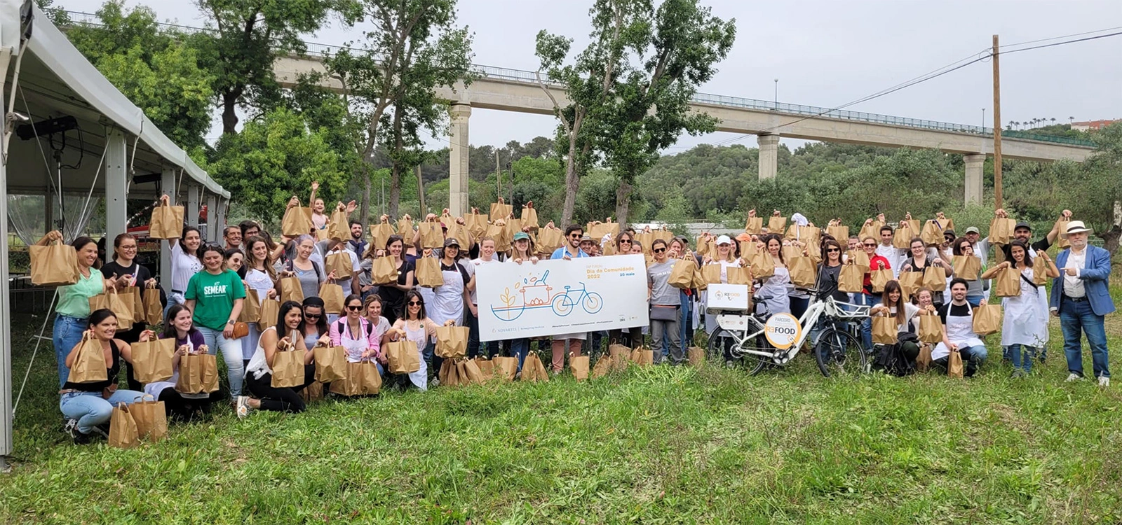 Image of people holding a banner