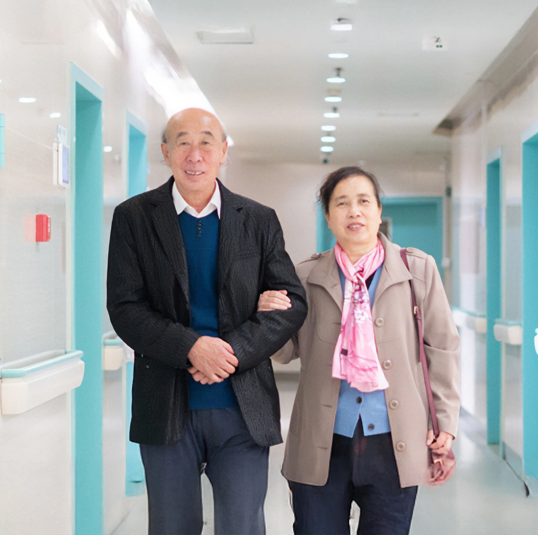 An old couple in the corridor of a hospital in China
