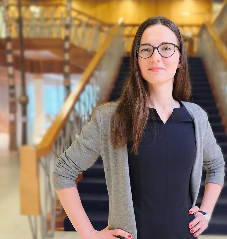 Banner Career page, woman in front of stairs