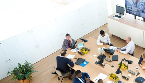 A photo of people in a meeting hall
