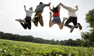 Group of young people jumping