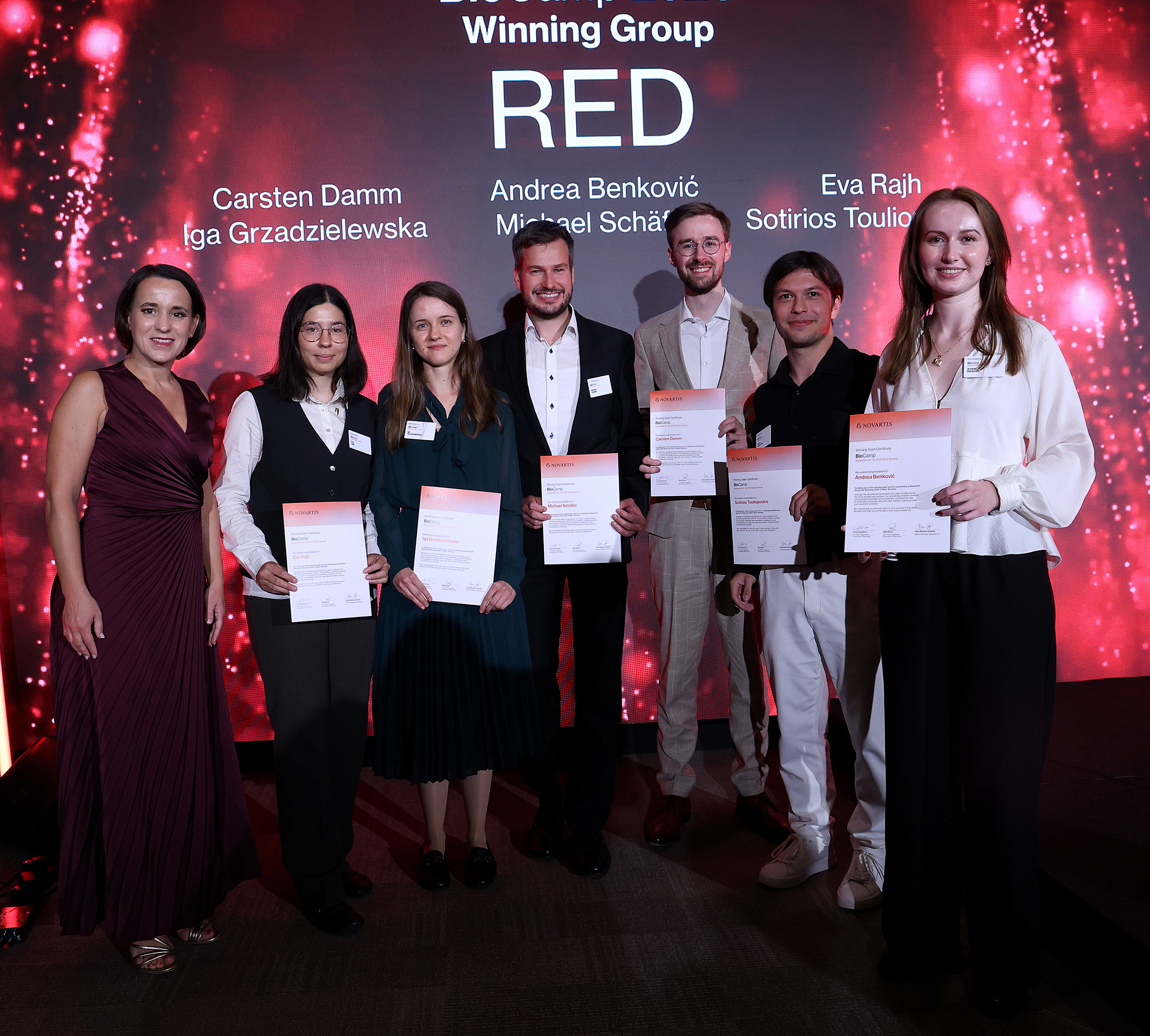 The Winning Group RED posing with their certificates on stage at BioCamp