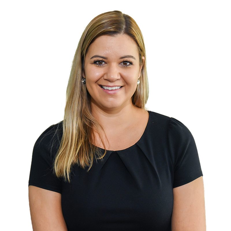 A woman smiling, looking into the camera