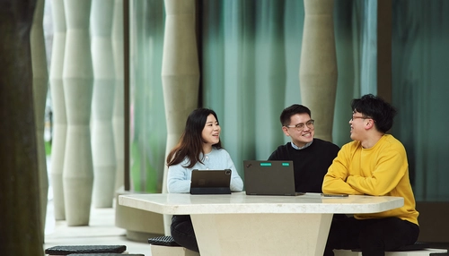 Three business people talking