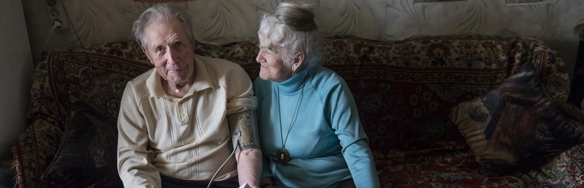Tamara Yachmentseva and her husband sitting on a couch