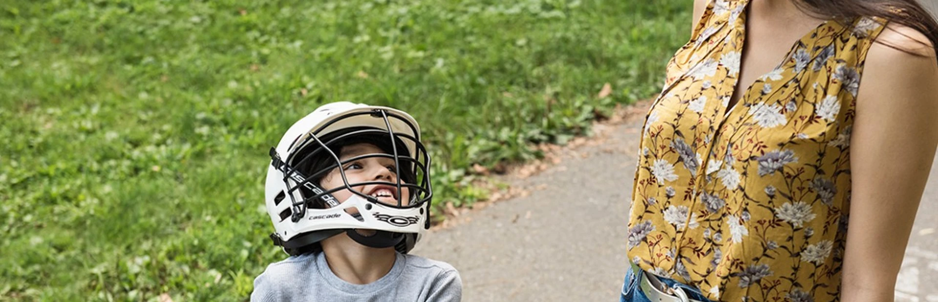 Mother takes son on bike ride in the park
