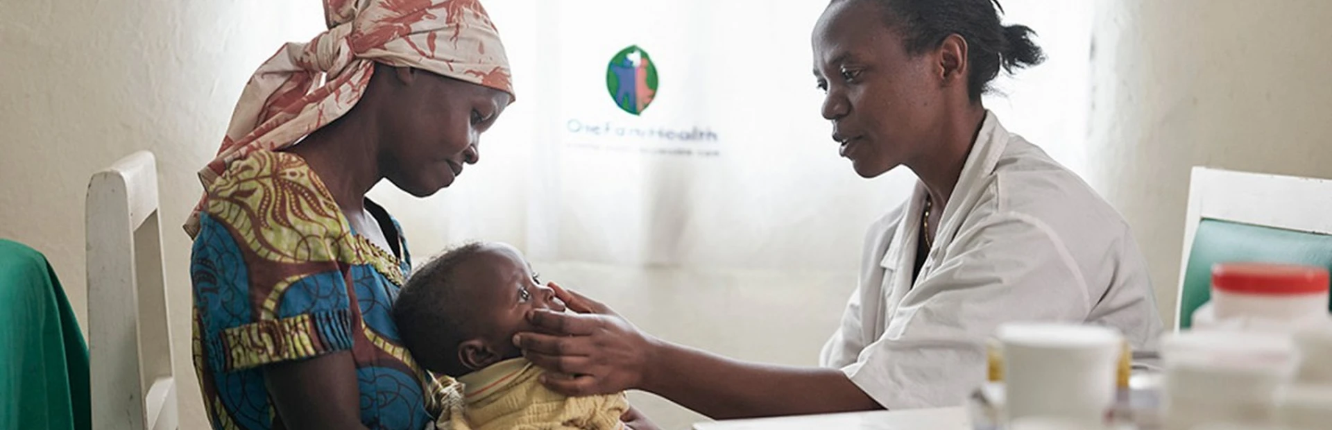 Doctor examining baby in Rwanda