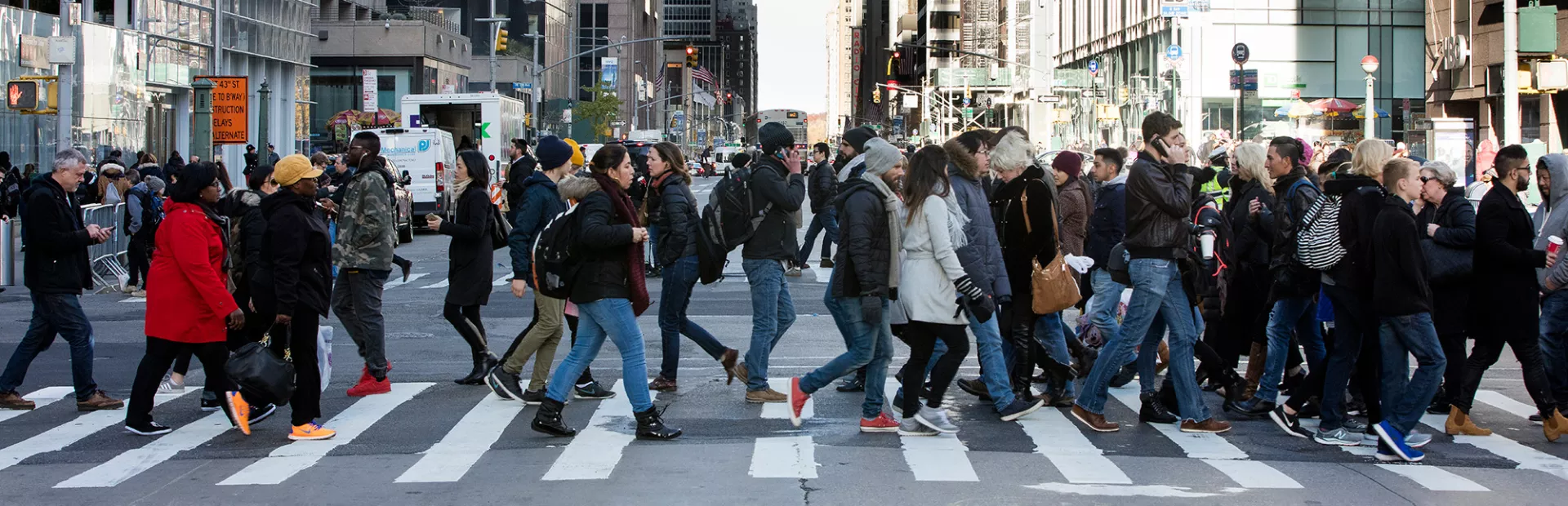 Crowd crossing a busy intersection