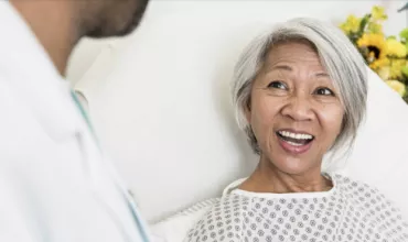 Woman smiling at doctor