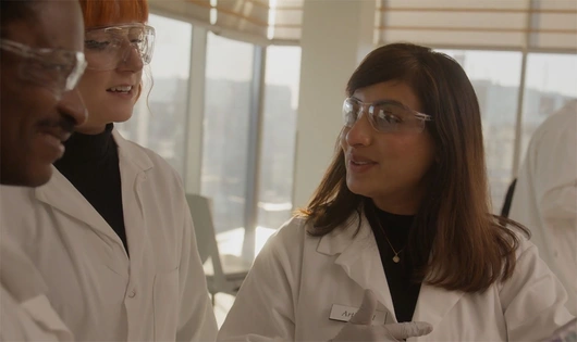 Photo of Arti, a neuroscientist, in a Cambridge, Massachusetts lab. She is one of multiple Novartis employees to share personal stories that led them to careers in drug development, pushing boundaries to create breakthroughs with the potential to transform lives.