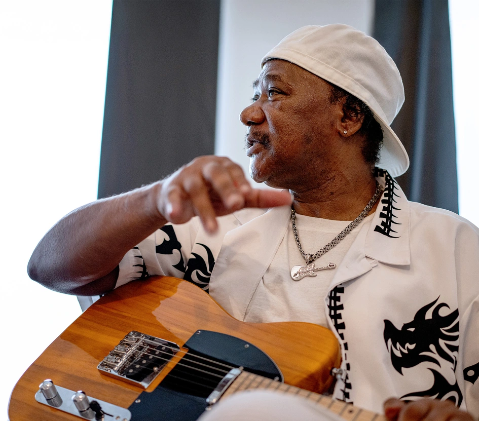 Portrait of Michael Williams playing electric guitar